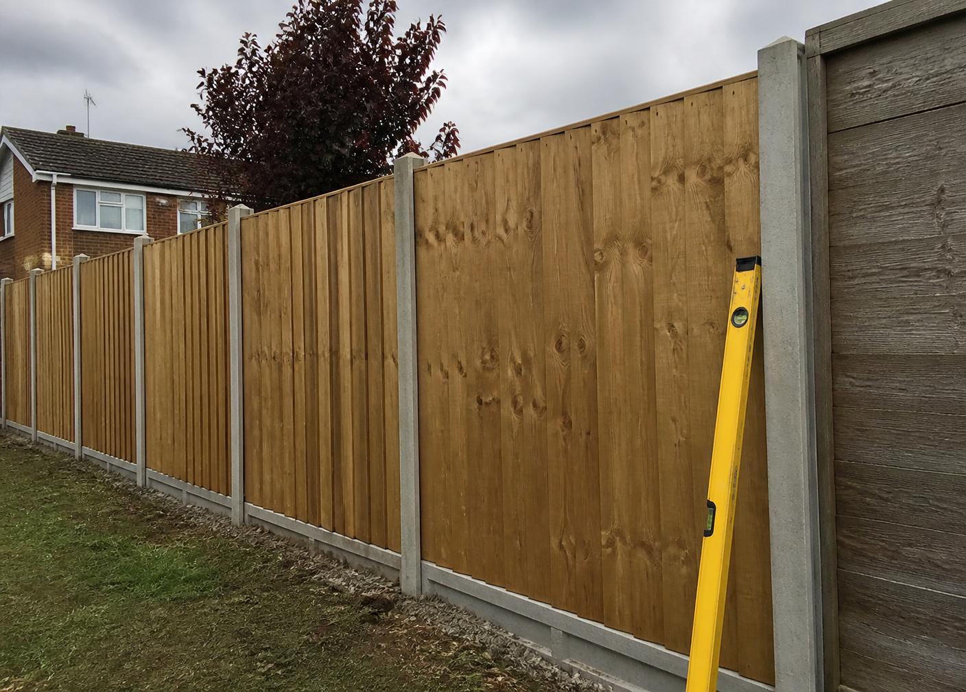 Newly installed timber fencing around a UK garden